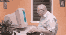 An elder employee dragging the 'My Computer' icon to `Recycle Bin` which makes his actual computer to disappear.
